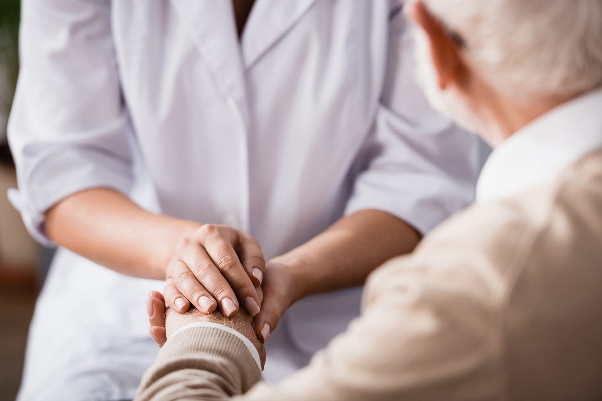 Closeup Of Caregiver Holding Patients Hand With Care